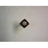 A Victorian 18ct Mourning Ring Cluster set with seven diamonds on a square jet table