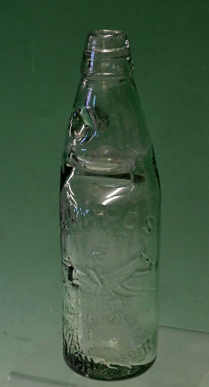 Horseracing – a Vic glass codd bottle c/w marble stopper retailed by Howards Manchester with - Image 2 of 2
