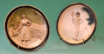 Pair of Vic tennis coloured wall plates – moulded in relief with a male and female tennis player