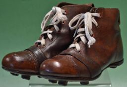 Pair of brown leather football boots, late 1940 early 1950s vintage, child size, polished and in
