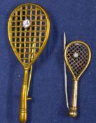 2x ladies tennis racket bar brooches – both yellow metal and each mounted with tennis balls – one