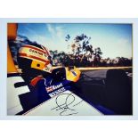Signed Nigel Mansell Formula One World Champion photograph for Williams, a colour action shot mf&g