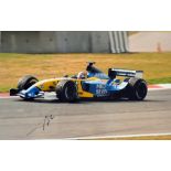 Signed Fernando Alonso Formula One racing photograph driving for Renault 2003-2006, two times