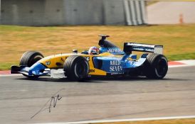 Signed Fernando Alonso Formula One racing photograph driving for Renault 2003-2006, two times