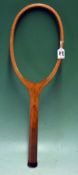 Fine unnamed Bussey wooden tennis racket fitted with an unusual wavy concave wedge (no strings)