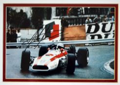 Nice signed John Surtees Formula One racing photograph depicting Surtees racing the Honda RA301,