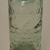 Horseracing – a Vic glass codd bottle c/w marble stopper retailed by Howards Manchester with