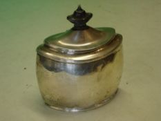 Silver Tea Caddy of oval form, the lid with wood finial. Sheffield 1907. 4 ¾" high. (Dents) 5ozs