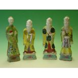 Chinese Porcelain. A group of four attendant figures, painted in coloured enamels. The tallest