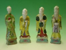 Chinese Porcelain. A group of four attendant figures, painted in coloured enamels. The tallest