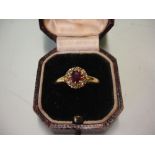 A Ruby and Diamond Cluster Ring in 18ct gold