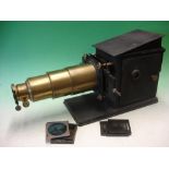 A Brass and Tinplate Magic Lantern with rackwork focusing, condenser and reflector, early electric