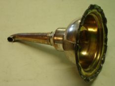 A Sheffield Plate Wine Funnel. The scrolled rim interspersed with shells, gilded bowl. 6" high