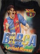 Lionel Messi. An F.C. Barcelona official black kit bag with large image of Messi and signed by him