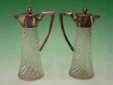 A Pair of French Carafons Wrythen moulded bodies with silver mounts and handles. 7 ½" high. Early