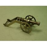 A Silversmith's Model of a Cannon. White metal. 3" long