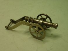 A Silversmith's Model of a Cannon. White metal. 3" long