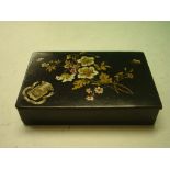 A lacquer Snuffbox decorated with flower spray and flying insect. Bears armorial "Fluctuat Nec