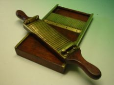 A Mahogany and Brass Pill Roller