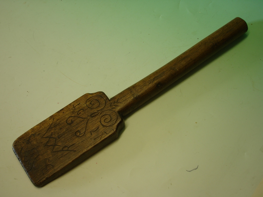 An 18th Century Treen Washing Bat. Scratch decorated with scrolls and heart, inscribed initials "B S