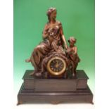 A French Mantle Clock. Black slate and speltar. Surmounted by a classical lady instructing a child