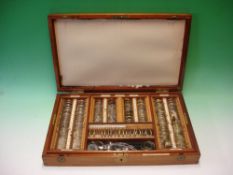 A Down Bros. Opthalmologist's Lens Set The mahogany case containing an array of various spectacle