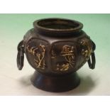 An Oriental Bronze Vase of octagonal form with reserved gilt decoration of birds and prunus raised