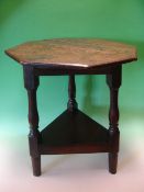 A Welsh Joined Oak Cricket Table. The octagonal moulded top raised on splayed baluster supports