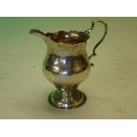 Silver Cream Jug of helmet form with double scroll handle. Crested. London 1768. 3 ¾" high. 2ozs