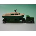 Minic Toys. A clockwork articulated transporter with cabin cruiser. 8 ¾" long