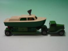 Minic Toys. A clockwork articulated transporter with cabin cruiser. 8 ¾" long