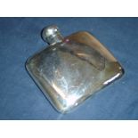 A Silver Hip Flask of curved form with locking hinged lid. 4 ½" wide. Birmingham 1901. 2ozs 18dwts
