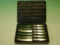 Georg Jensen. A cased set of six dessert knives with silver handles, import and date marks for 1931