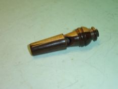 A Lignum Vitae Whistle with screw threaded top. 3" long