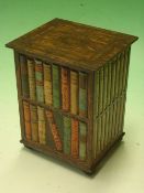 A Huntley and Palmers Biscuit Tin formed as a bookcase with volumes. 6 ¼" high. (One hinge broken)