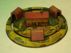 A Tinplate Model Railway. The building to the centre housing the clockwork motor that powers the