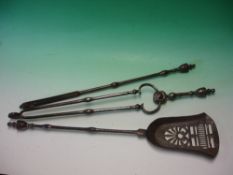 A Set of Steel Fire Irons comprising tongs, shovel and a poker, each with vase terminals