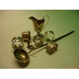 Miscellaneous Silver Viz. A cream jug, five napkin rings, a toddy ladle and a menu holder. 5ozs