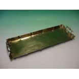 An Arts and Crafts Brass Tray chased with vine fruits. 19 ½" wide