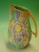 Beswick. An Art Deco Jug no. W611, the relief decoration of flowers painted in muted tones. 10 ¾"