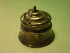 A Pewter Inkwell with domed lid and four quill apertures, lead weighted base. Early 19th century. 4"