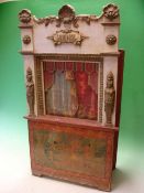 A Guignol Puppet Theatre. Wood and gilt gesso, decorated with shells, scrollwork and caryatids
