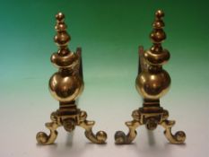 A Pair of Brass Fire dogs each moulded with a lion mask. 14 ¾" high 19th century