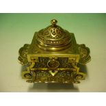 Brass Inkwell decorated with repousse scrolls and classical portrait medallions. 19th century.