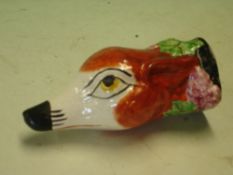 A Stirrup Cup. A fox head with vine fruits. Staffordshire 19th century