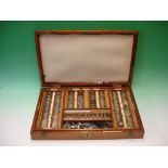 A Down Bros. Opthalmologist's Lens Set The mahogany case containing an array of various spectacle