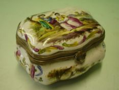 A Continental Enamel Box. Gilt metal mounts. The lid with painted scene of lovers in a landscape and