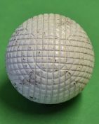 Original c1900 line mesh pattern rubber core golf ball - retaining 95% white paint finish but has