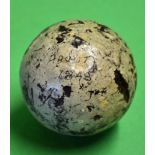An early smooth gutty golf ball with some strike marks but in good round condition and some original