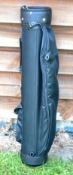 Fine and new black canvass and leather golf bag - made in England - circular shaped with single